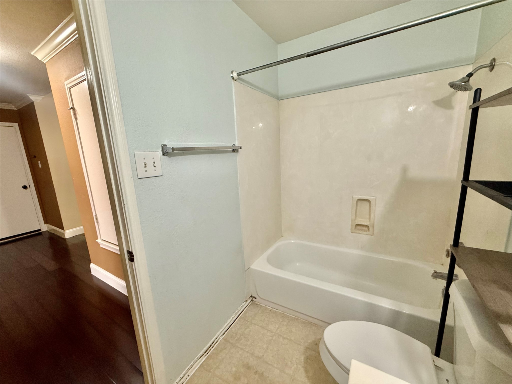 12820 Waynespur Lane Elgin, TX 78621 - Photo 21 of 26 Bathroom featuring bathing tub / shower combination and ornamental molding