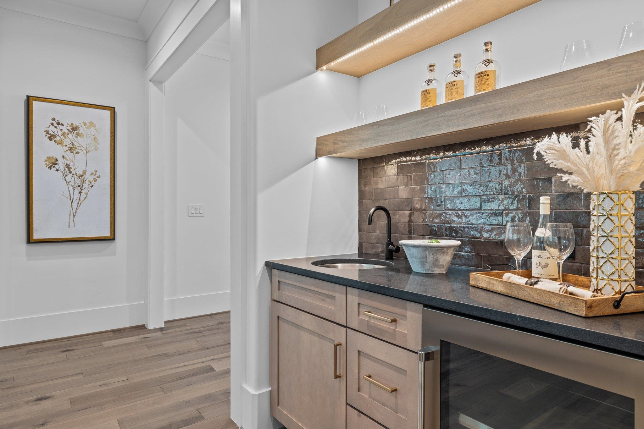 7605 Harps Mill Road Raleigh, NC 27615 - Photo 11 of 70 a kitchen with a sink a stove and wooden floor