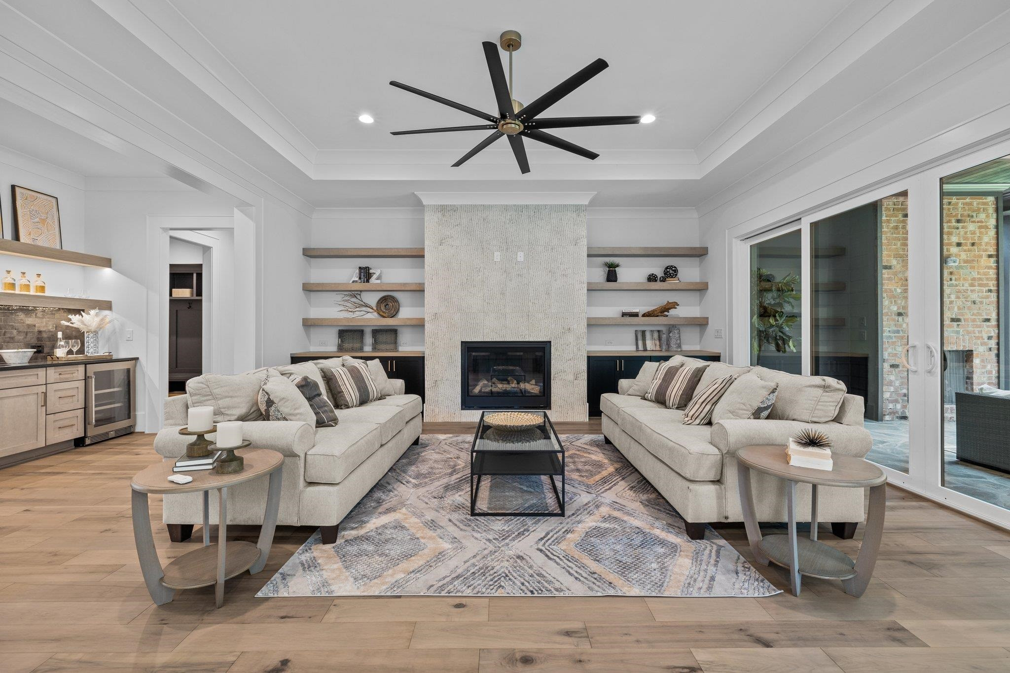 7605 Harps Mill Road Raleigh, NC 27615 - Photo 12 of 70 a living room with furniture a rug and a fireplace