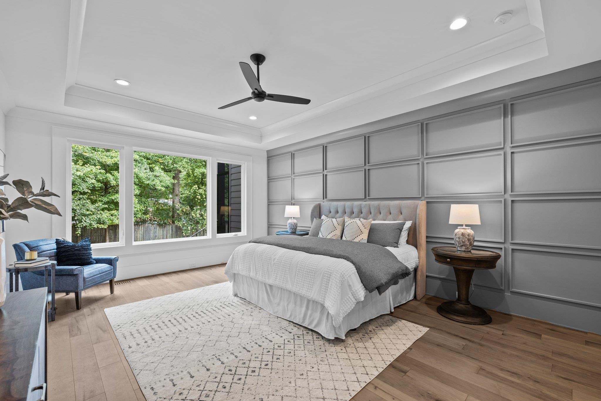 7605 Harps Mill Road Raleigh, NC 27615 - Photo 29 of 70 a large bedroom with a bed and wooden floor