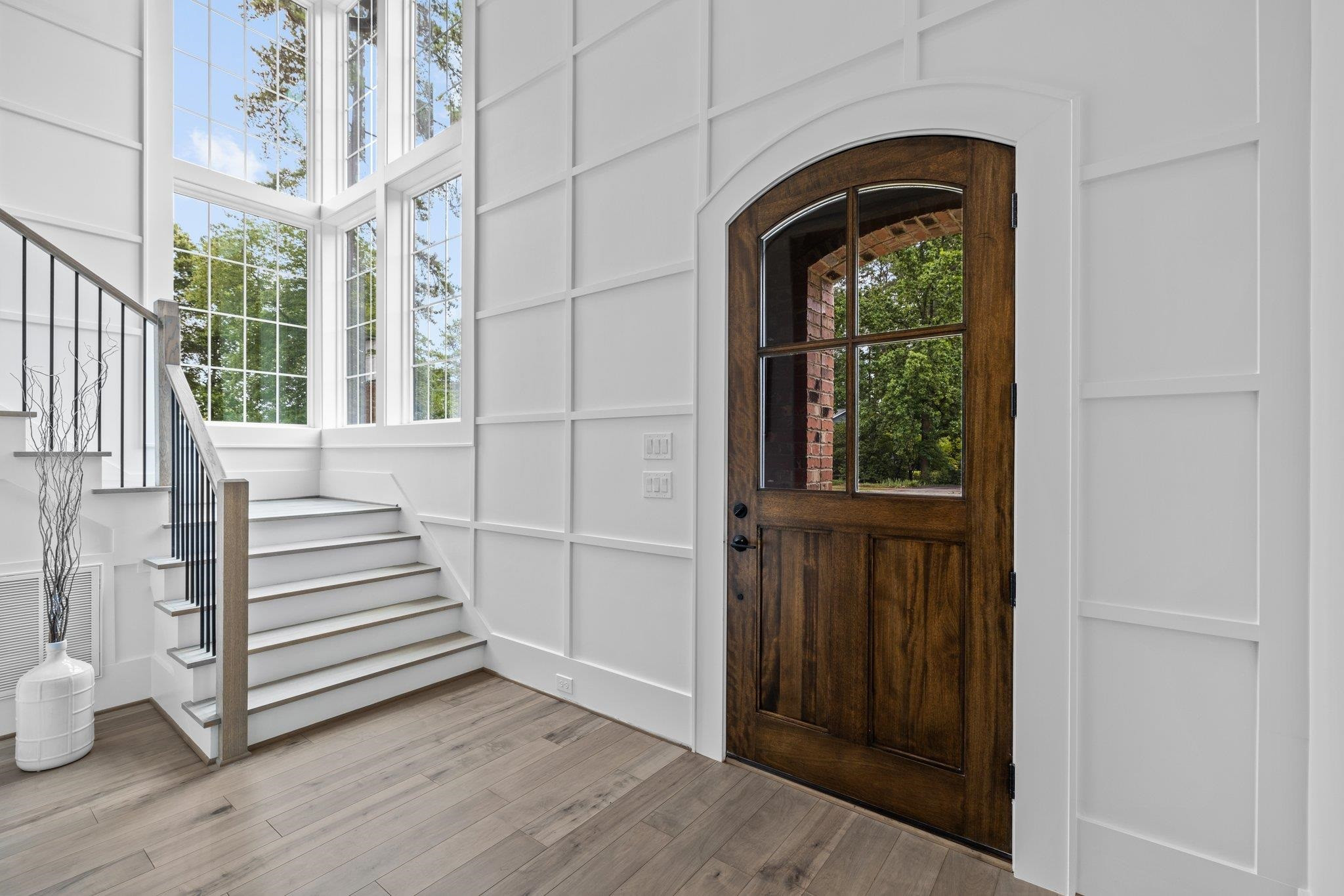 7605 Harps Mill Road Raleigh, NC 27615 - Photo 3 of 70 a view of a entryway door with wooden floor
