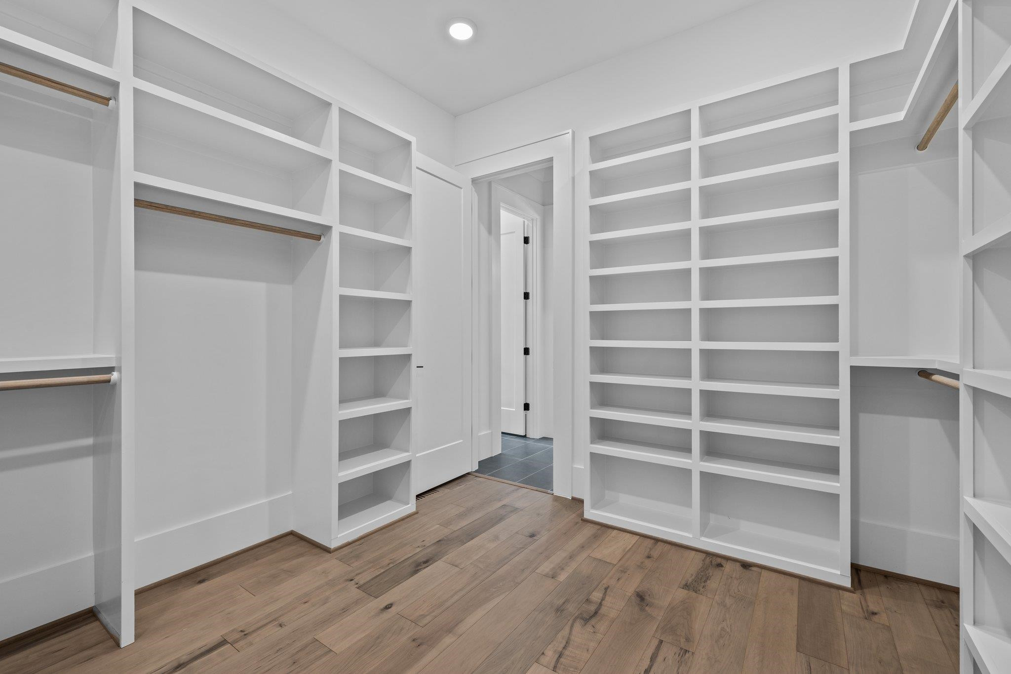 7605 Harps Mill Road Raleigh, NC 27615 - Photo 32 of 70 a view of an empty room with a window and wooden floor