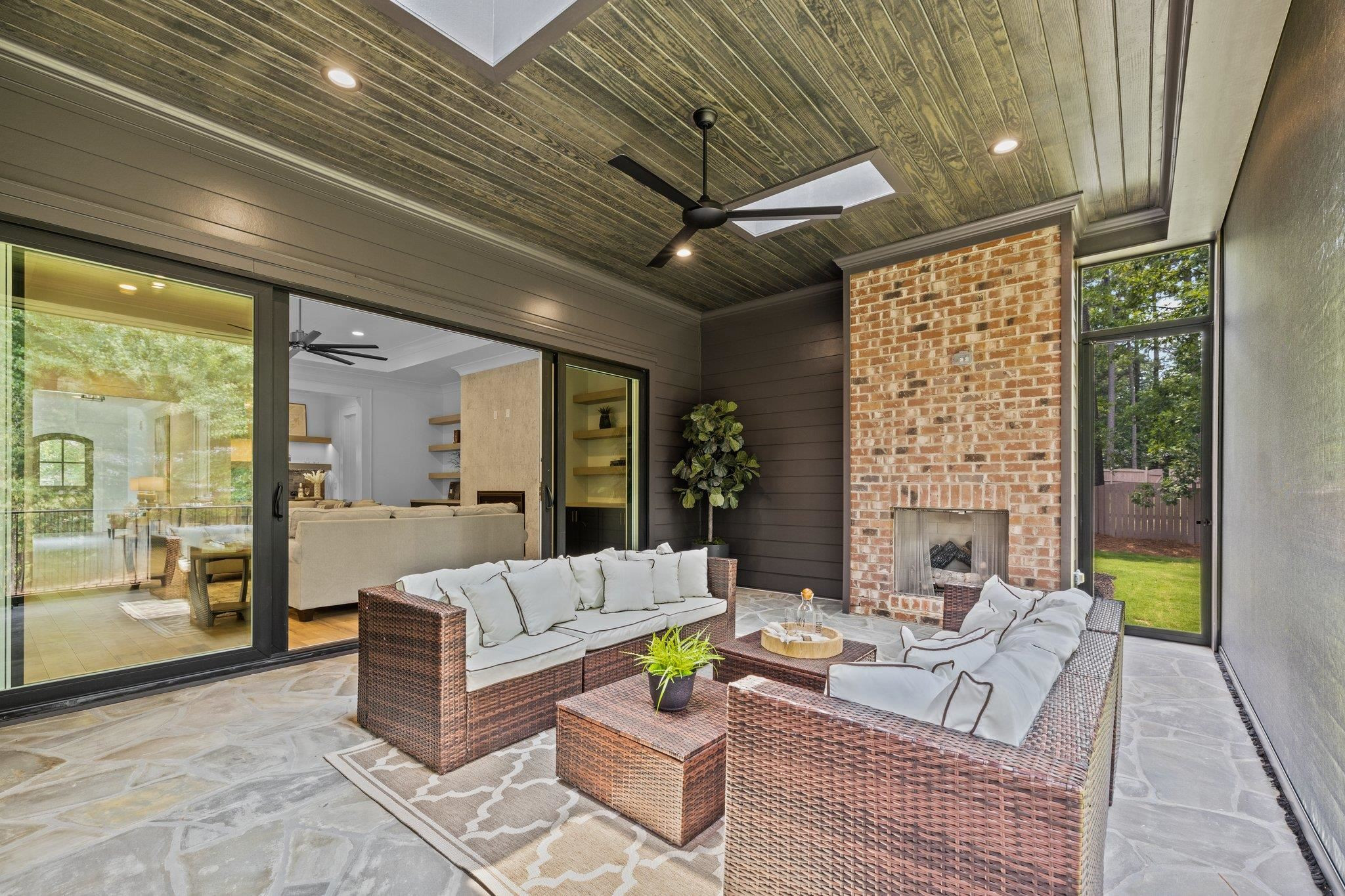 7605 Harps Mill Road Raleigh, NC 27615 - Photo 43 of 70 a living room with fireplace furniture and a large window
