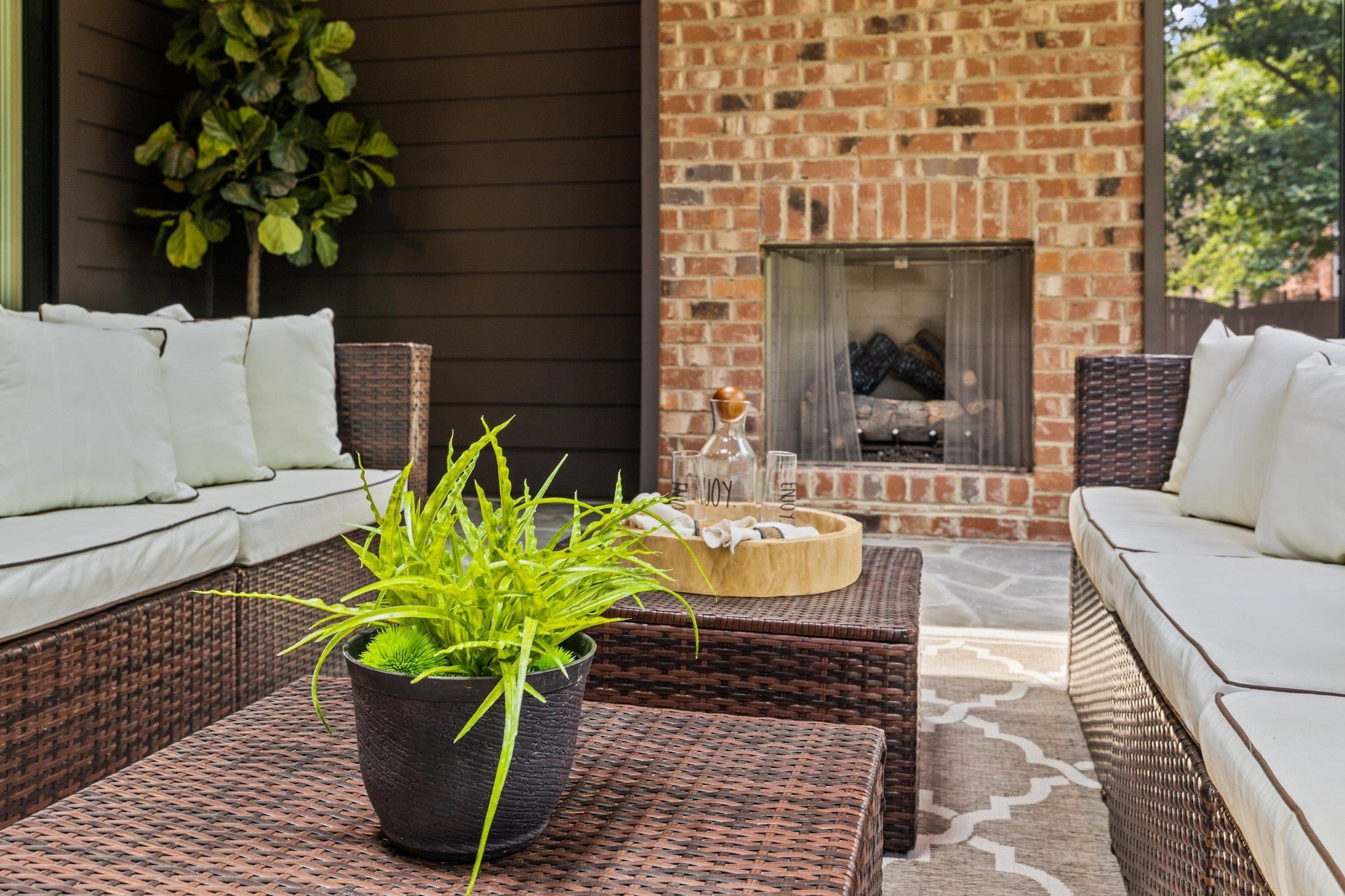 7605 Harps Mill Road Raleigh, NC 27615 - Photo 44 of 70 a view of a porch with chairs and a potted plant