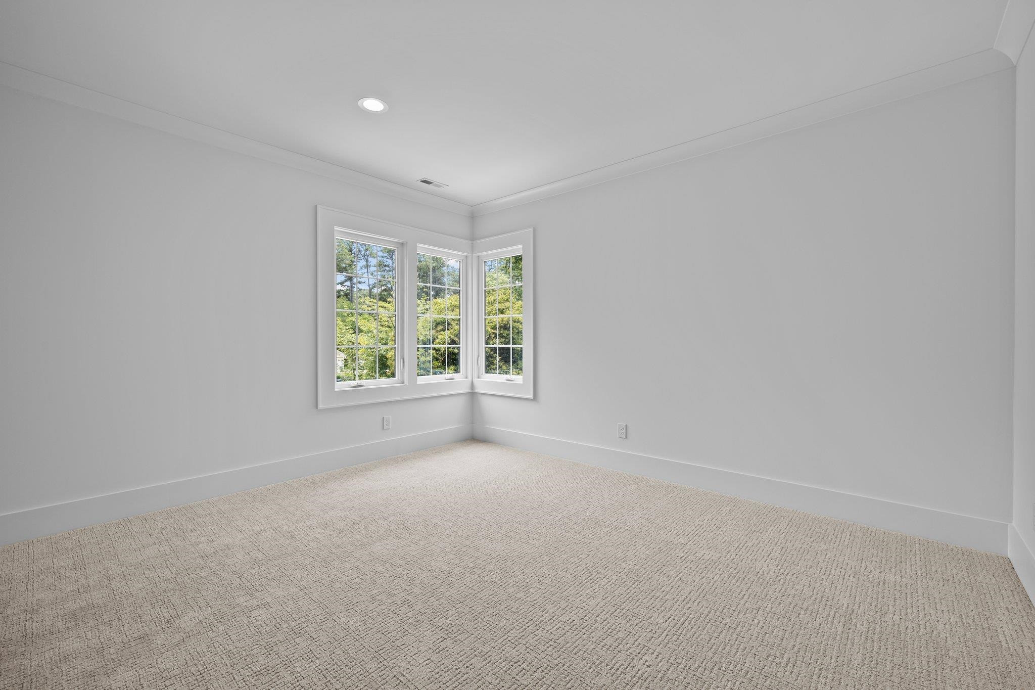 7605 Harps Mill Road Raleigh, NC 27615 - Photo 47 of 70 an empty room with windows