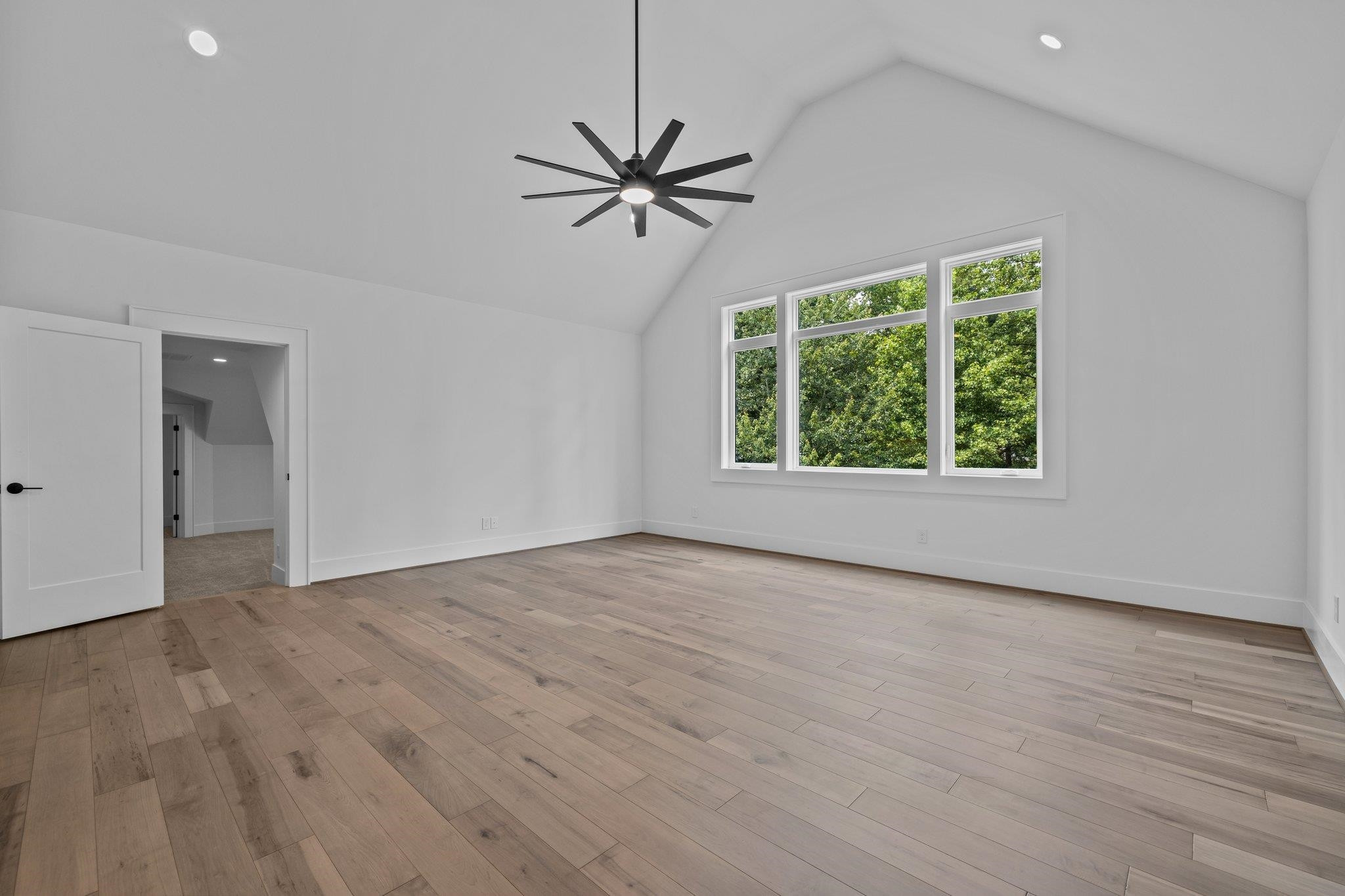 7605 Harps Mill Road Raleigh, NC 27615 - Photo 51 of 70 a view of a livingroom with a ceiling fan and window