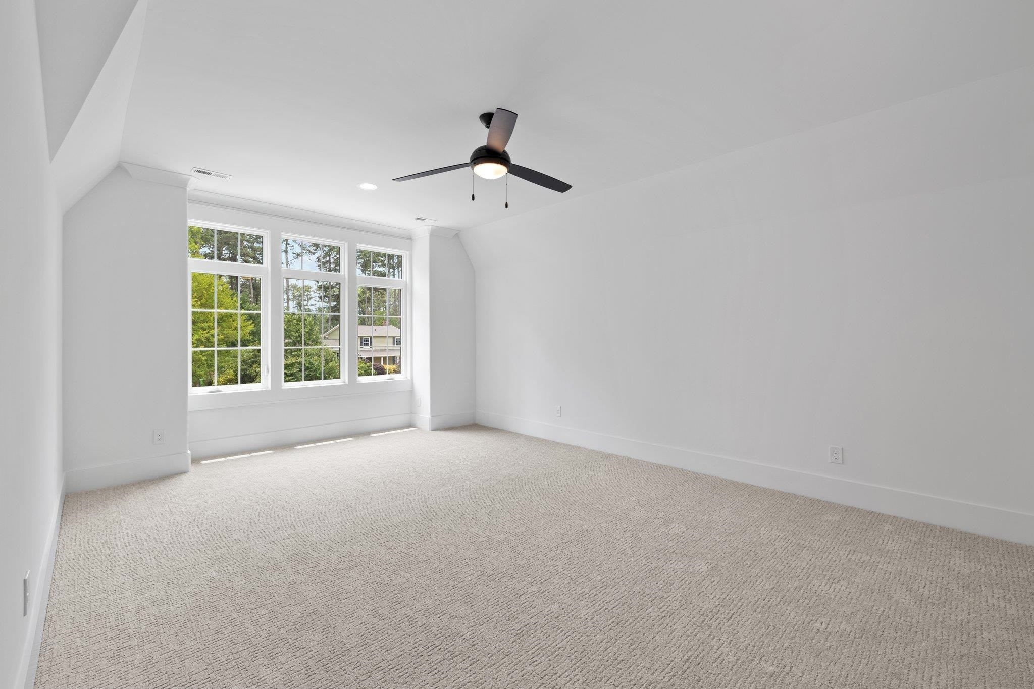 7605 Harps Mill Road Raleigh, NC 27615 - Photo 57 of 70 an empty room with windows