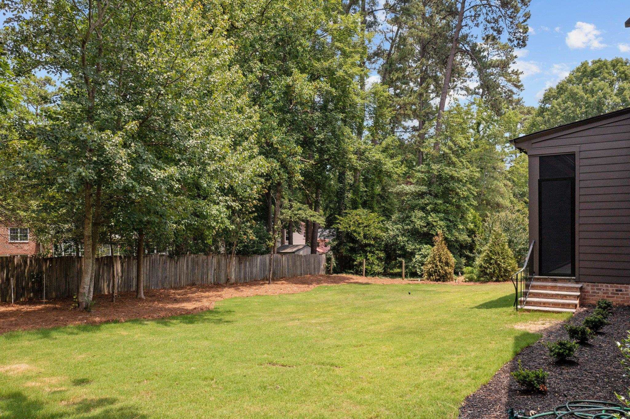 7605 Harps Mill Road Raleigh, NC 27615 - Photo 62 of 70 a view of swimming pool with trees in the background