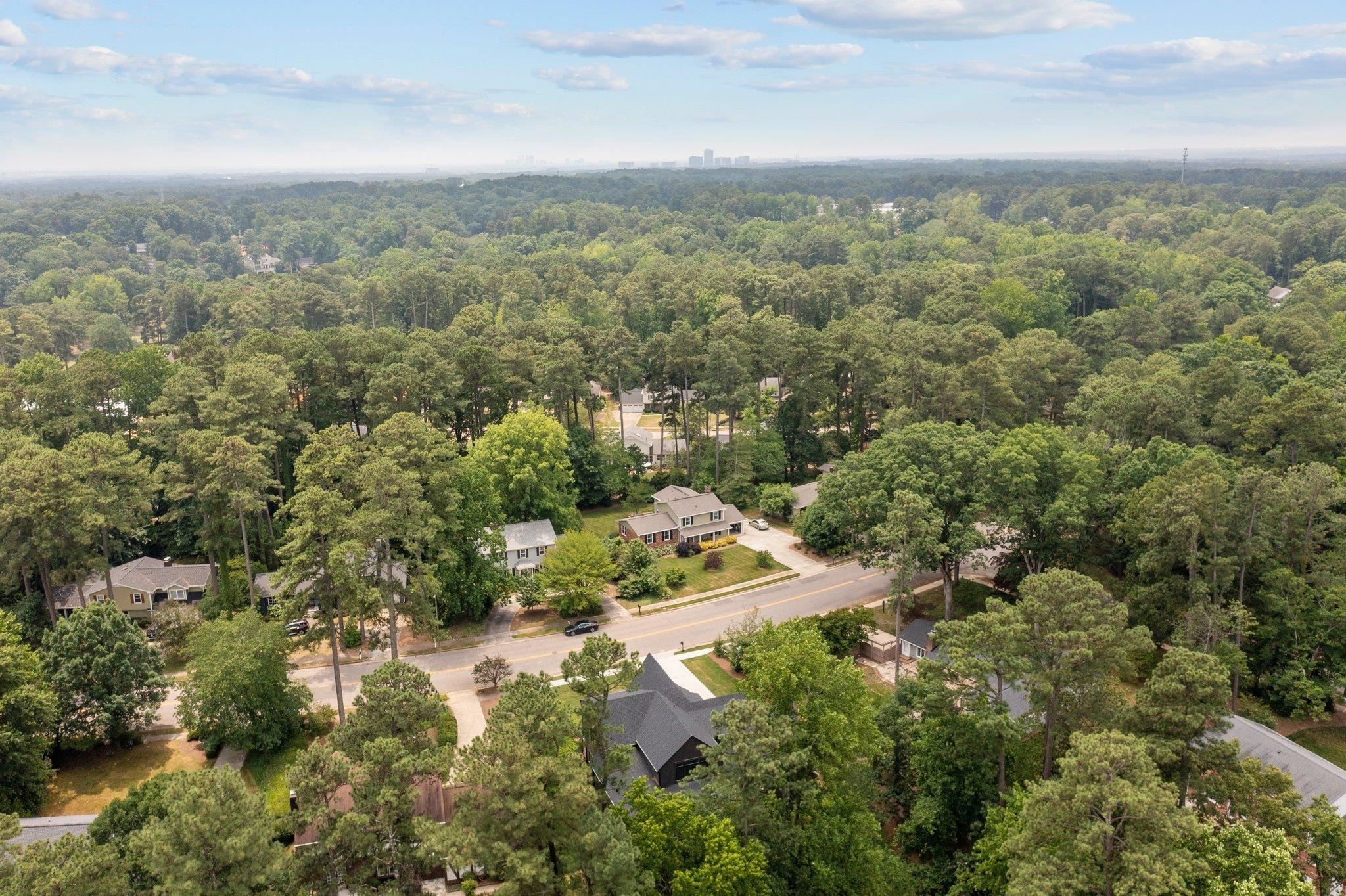 7605 Harps Mill Road Raleigh, NC 27615 - Photo 64 of 70 an aerial view of residential houses with outdoor space and trees