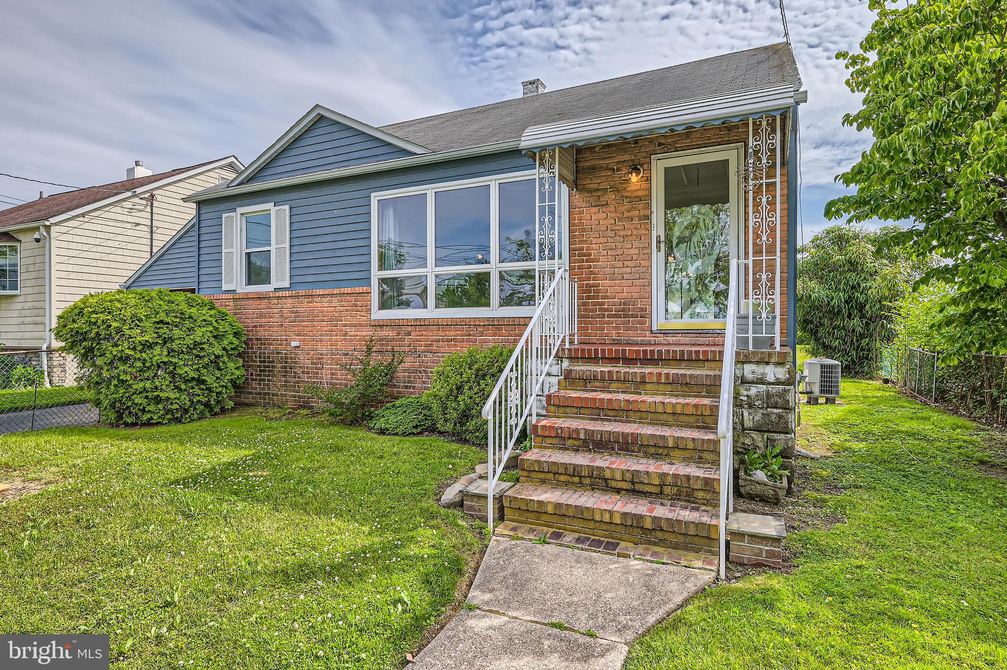 6805 River Drive Road Baltimore, MD 21219 - Photo 1 of 28 a front view of a house with a yard