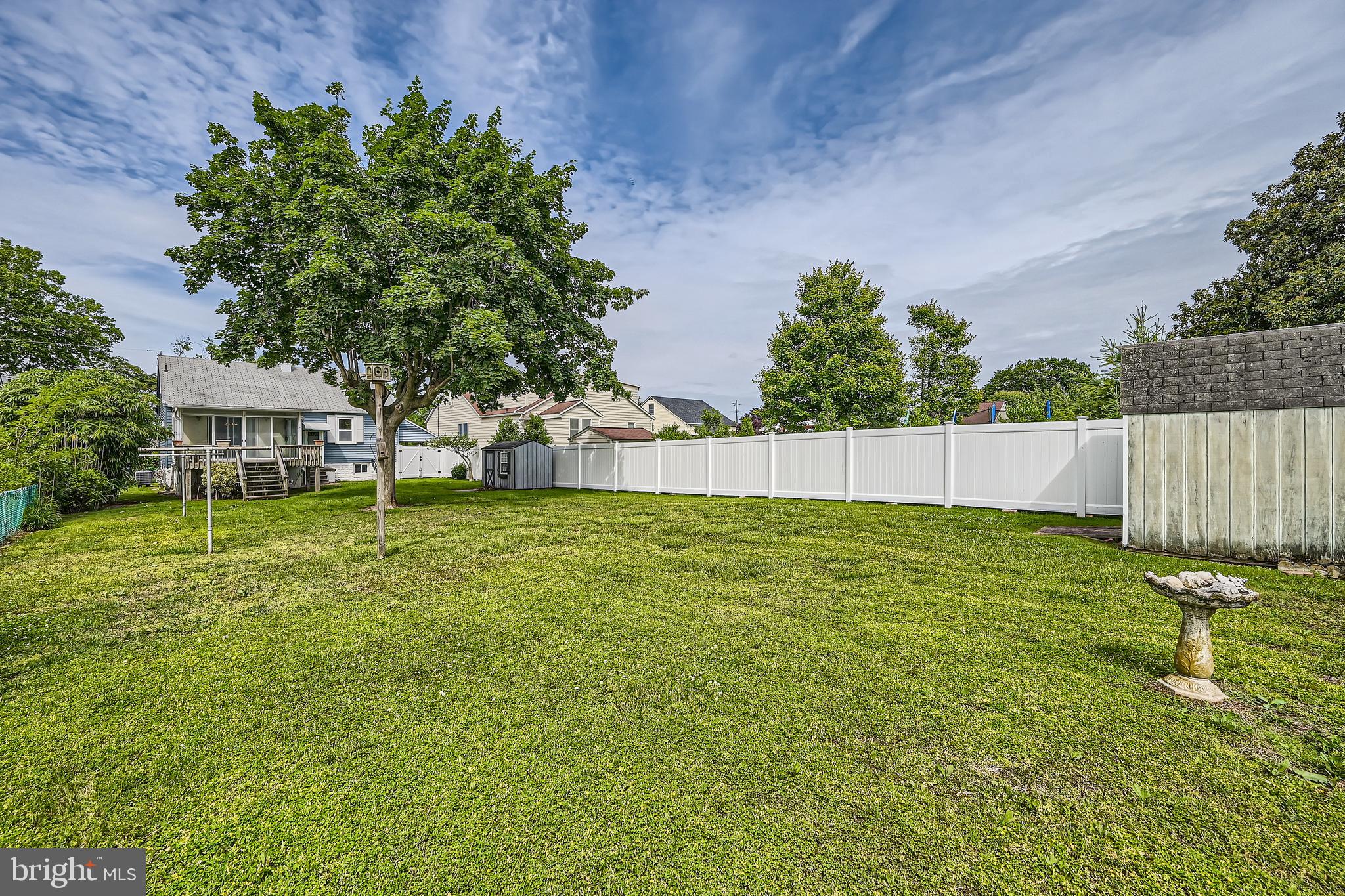6805 River Drive Road Baltimore, MD 21219 - Photo 24 of 28 a backyard of a house with table and chairs