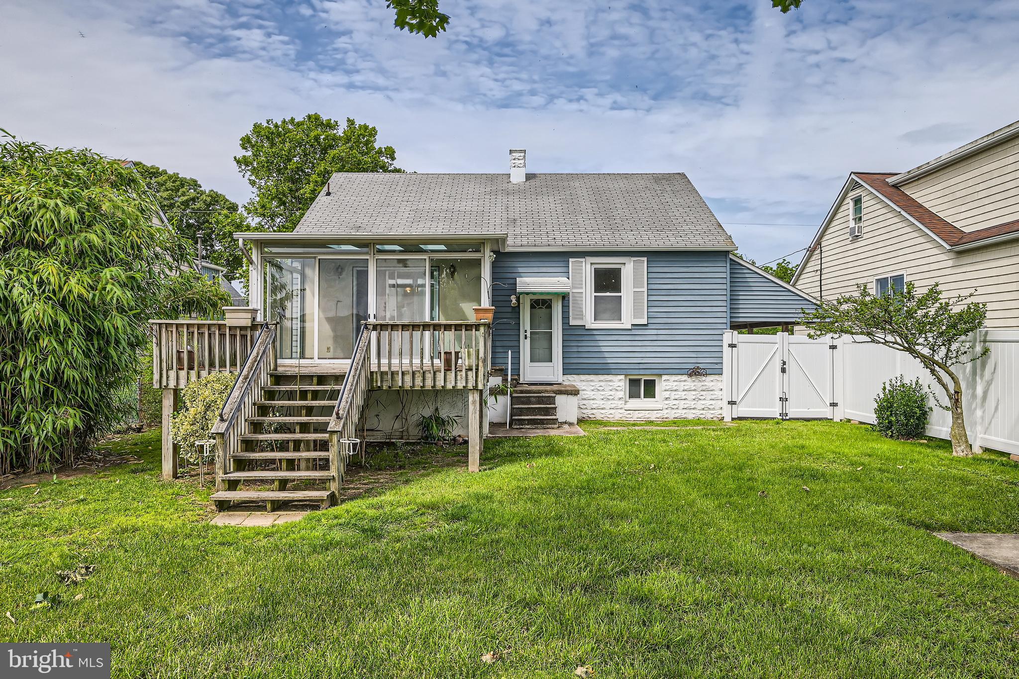 6805 River Drive Road Baltimore, MD 21219 - Photo 26 of 28 a front view of a house with a garden