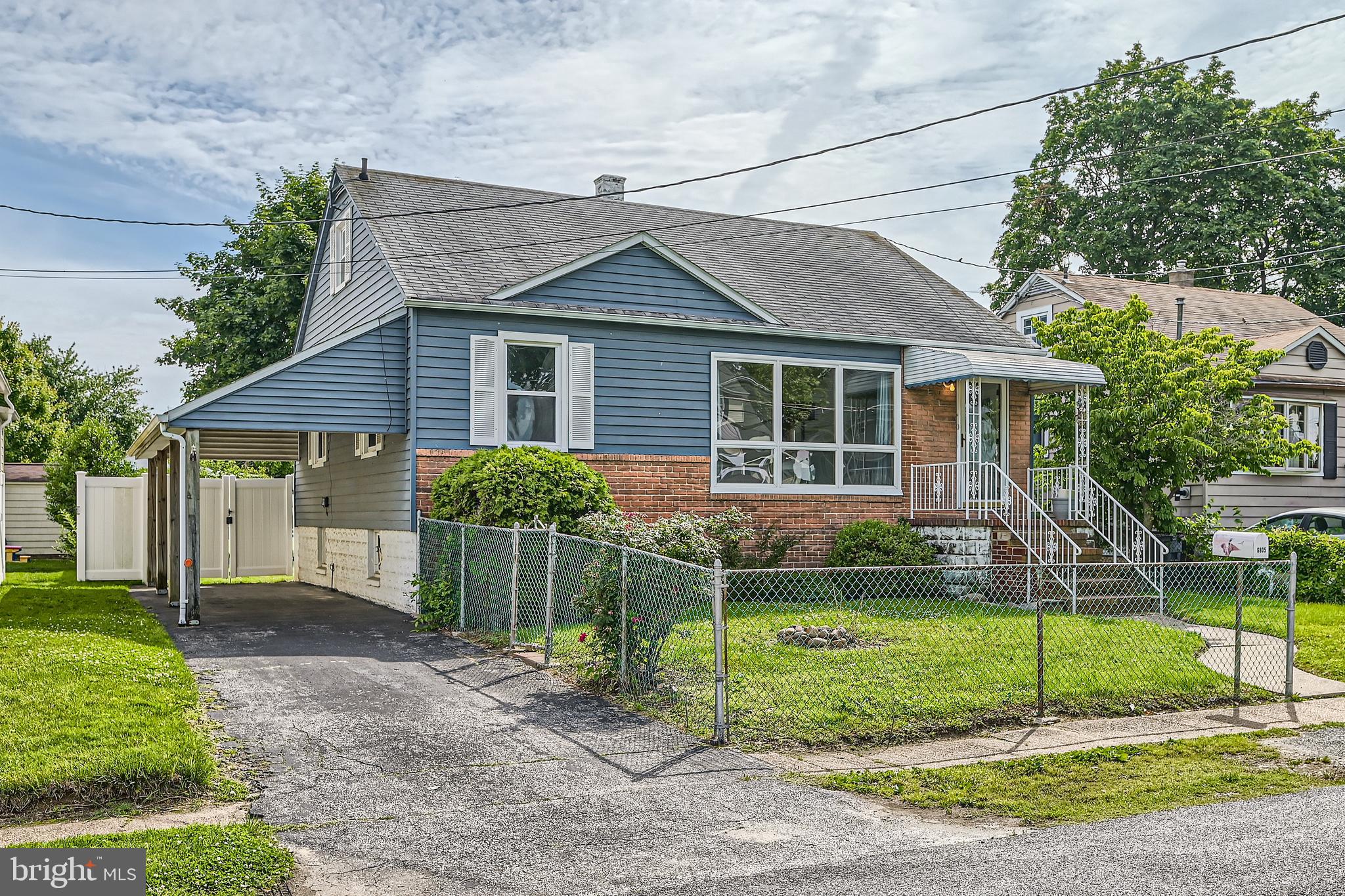 6805 River Drive Road Baltimore, MD 21219 - Photo 3 of 28 a view of a house with a yard and large tree