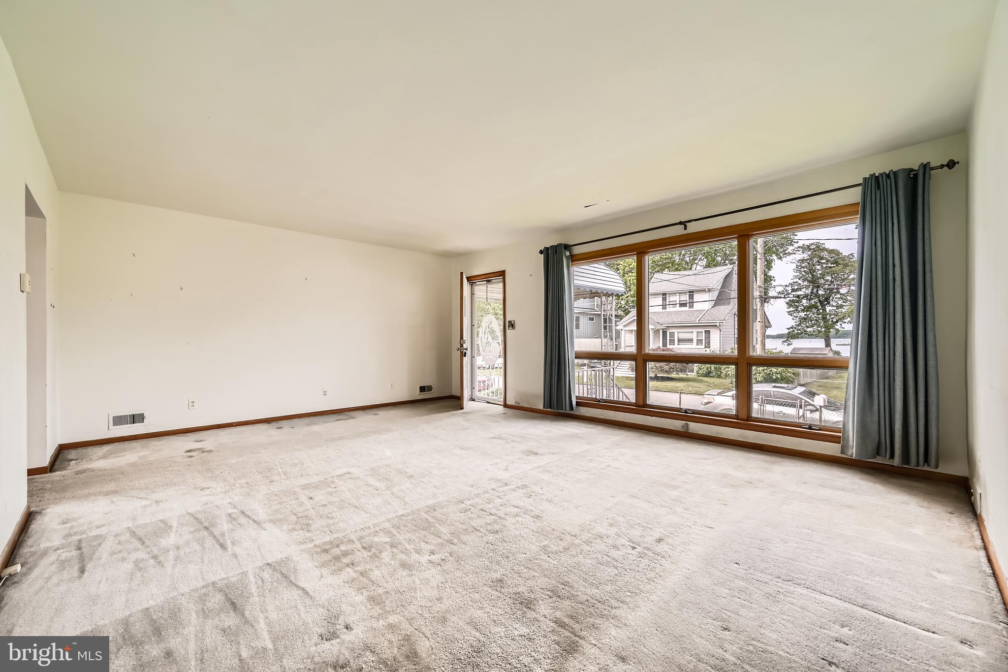 6805 River Drive Road Baltimore, MD 21219 - Photo 4 of 28 a view of an empty room with a window