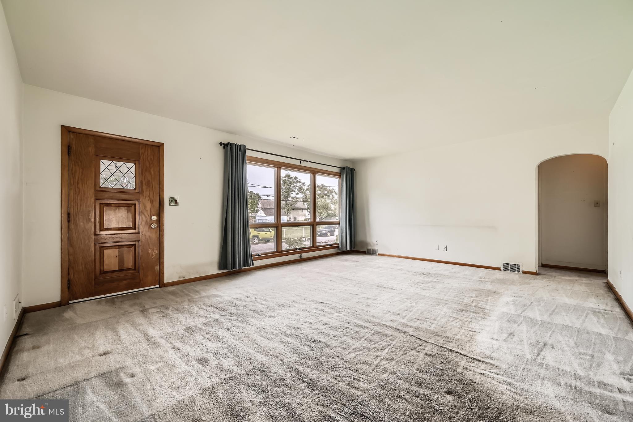 6805 River Drive Road Baltimore, MD 21219 - Photo 5 of 28 an empty room with windows and closet