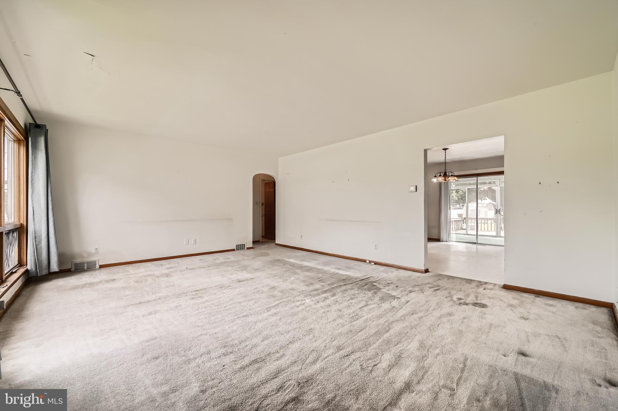 6805 River Drive Road Baltimore, MD 21219 - Photo 6 of 28 a view of an empty room with a window