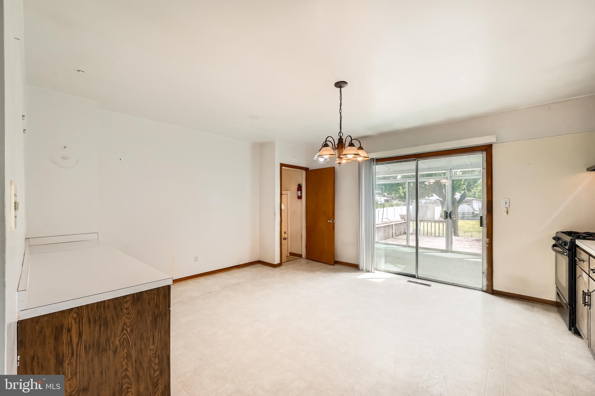 6805 River Drive Road Baltimore, MD 21219 - Photo 7 of 28 a view of empty room with windows