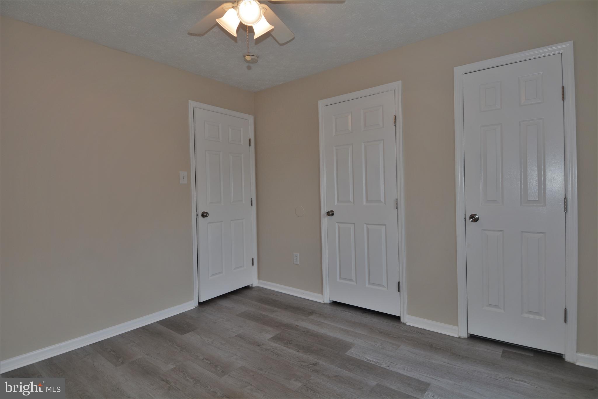 1307 J Clover Valley Way, Unit 1307J Edgewood, MD 21040 - Photo 14 of 25 wooden floor in an empty room