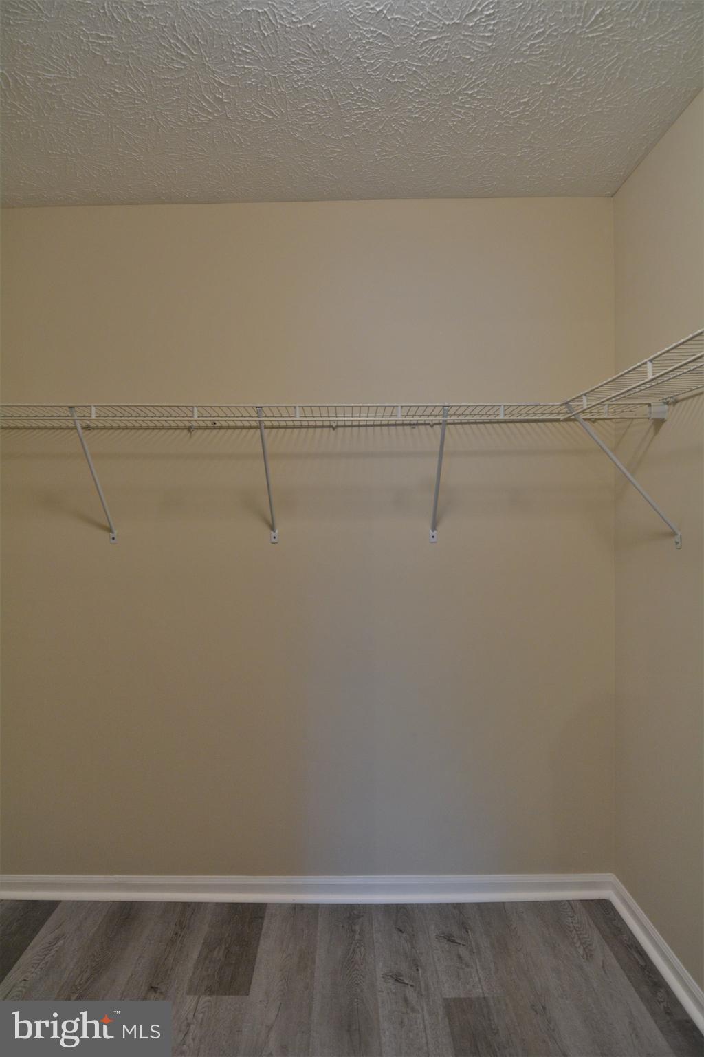 1307 J Clover Valley Way, Unit 1307J Edgewood, MD 21040 - Photo 19 of 25 a view of a room with racks on the wall