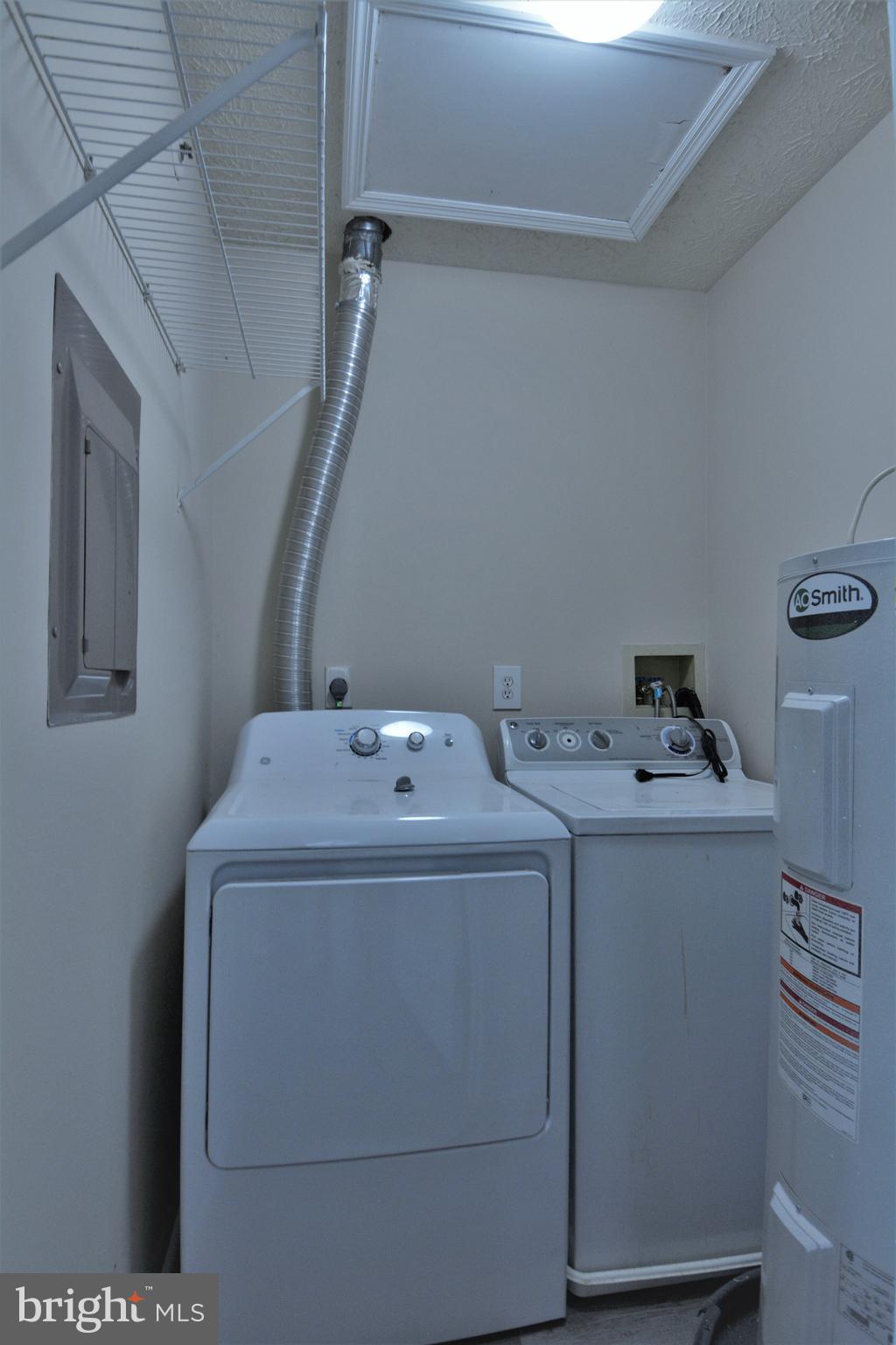 1307 J Clover Valley Way, Unit 1307J Edgewood, MD 21040 - Photo 22 of 25 a utility room with dryer and washer