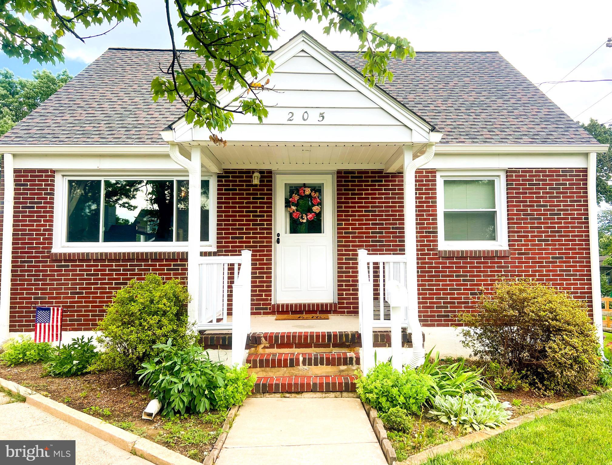 205 South Longcross Road Linthicum Heights, MD 21090 - Photo 1 of 57 a front view of a house with a garden