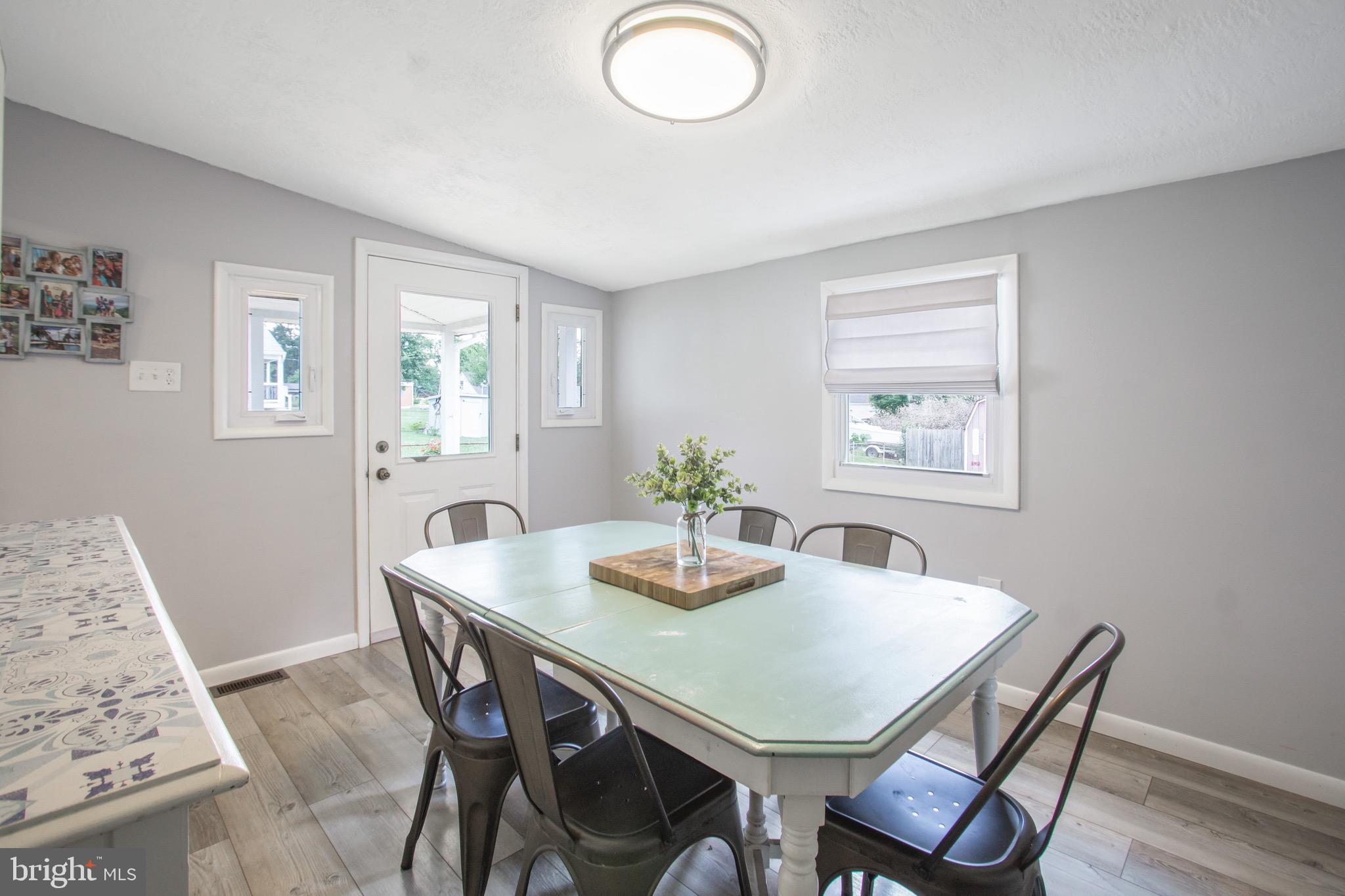 205 South Longcross Road Linthicum Heights, MD 21090 - Photo 16 of 57 a view of a dining room with furniture and wooden floor