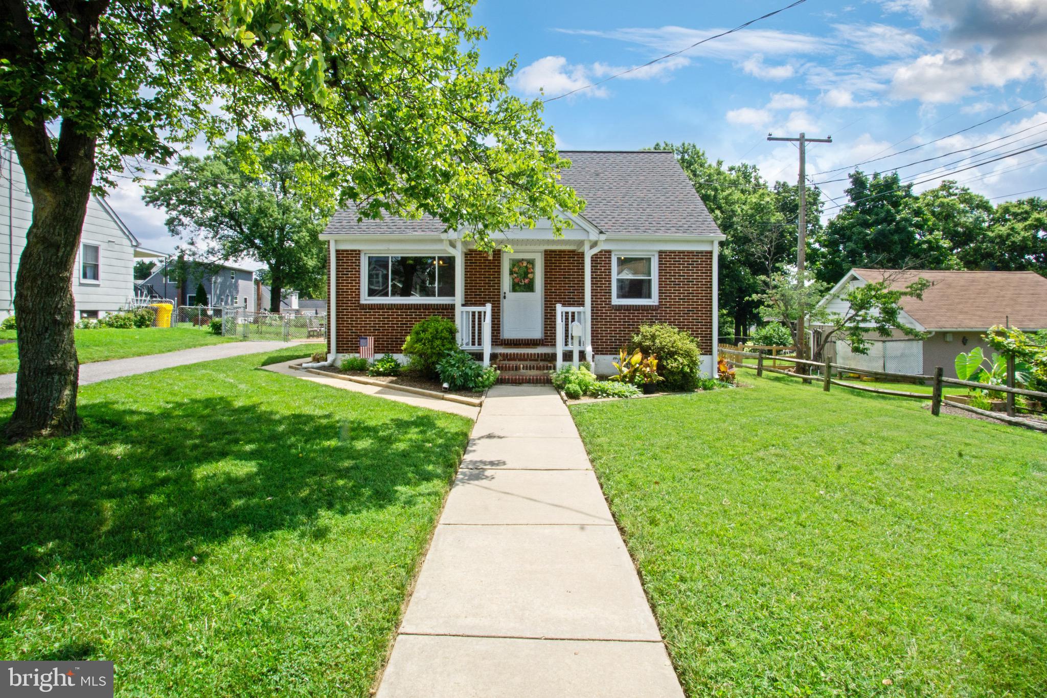 205 South Longcross Road Linthicum Heights, MD 21090 - Photo 2 of 57 a front view of a house with garden