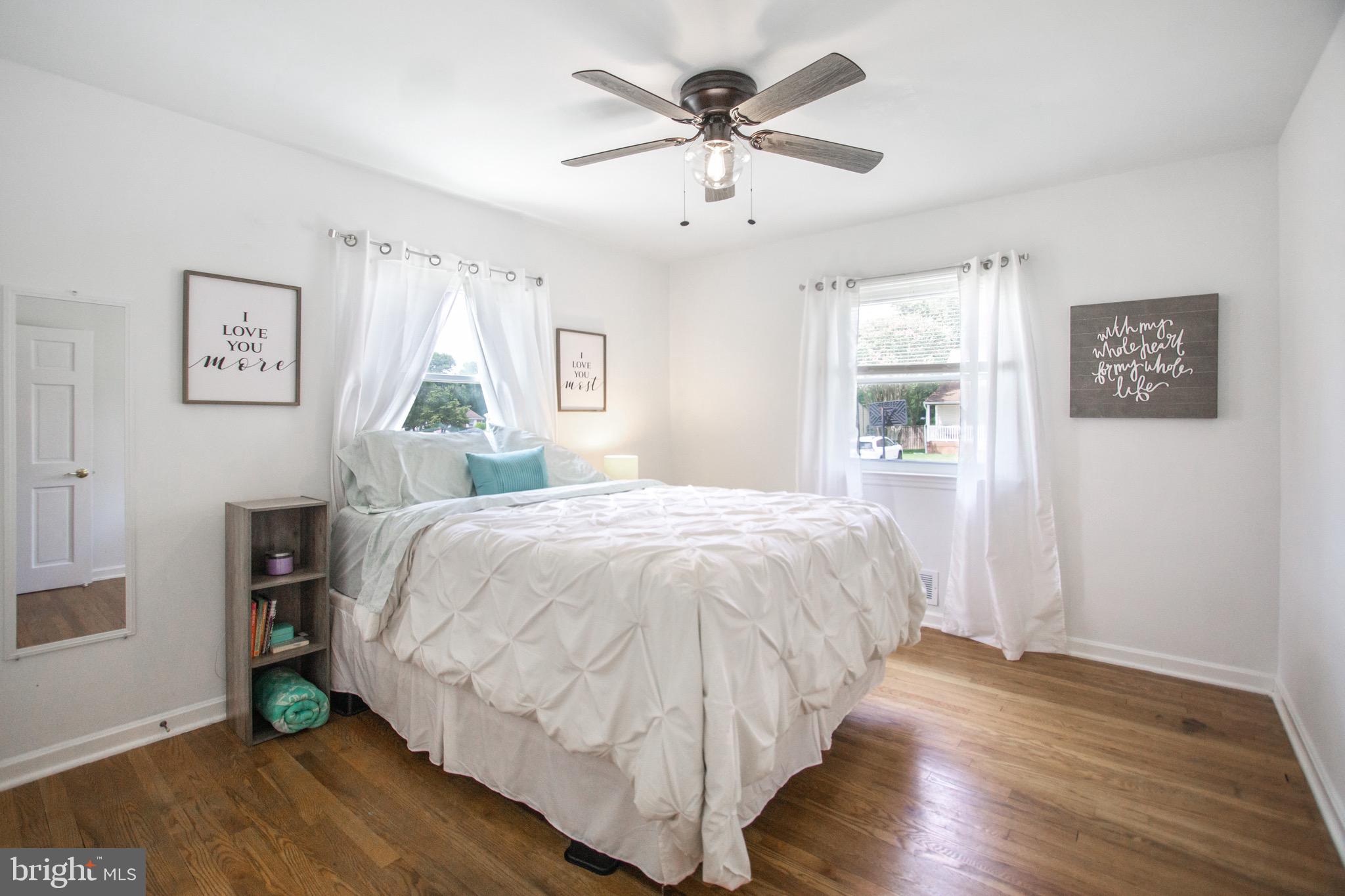 205 South Longcross Road Linthicum Heights, MD 21090 - Photo 24 of 57 a spacious bedroom with a bed and a window