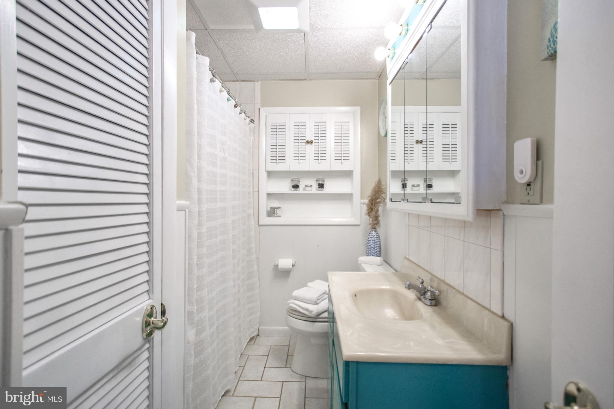 205 South Longcross Road Linthicum Heights, MD 21090 - Photo 31 of 57 a bathroom with a sink toilet and shower