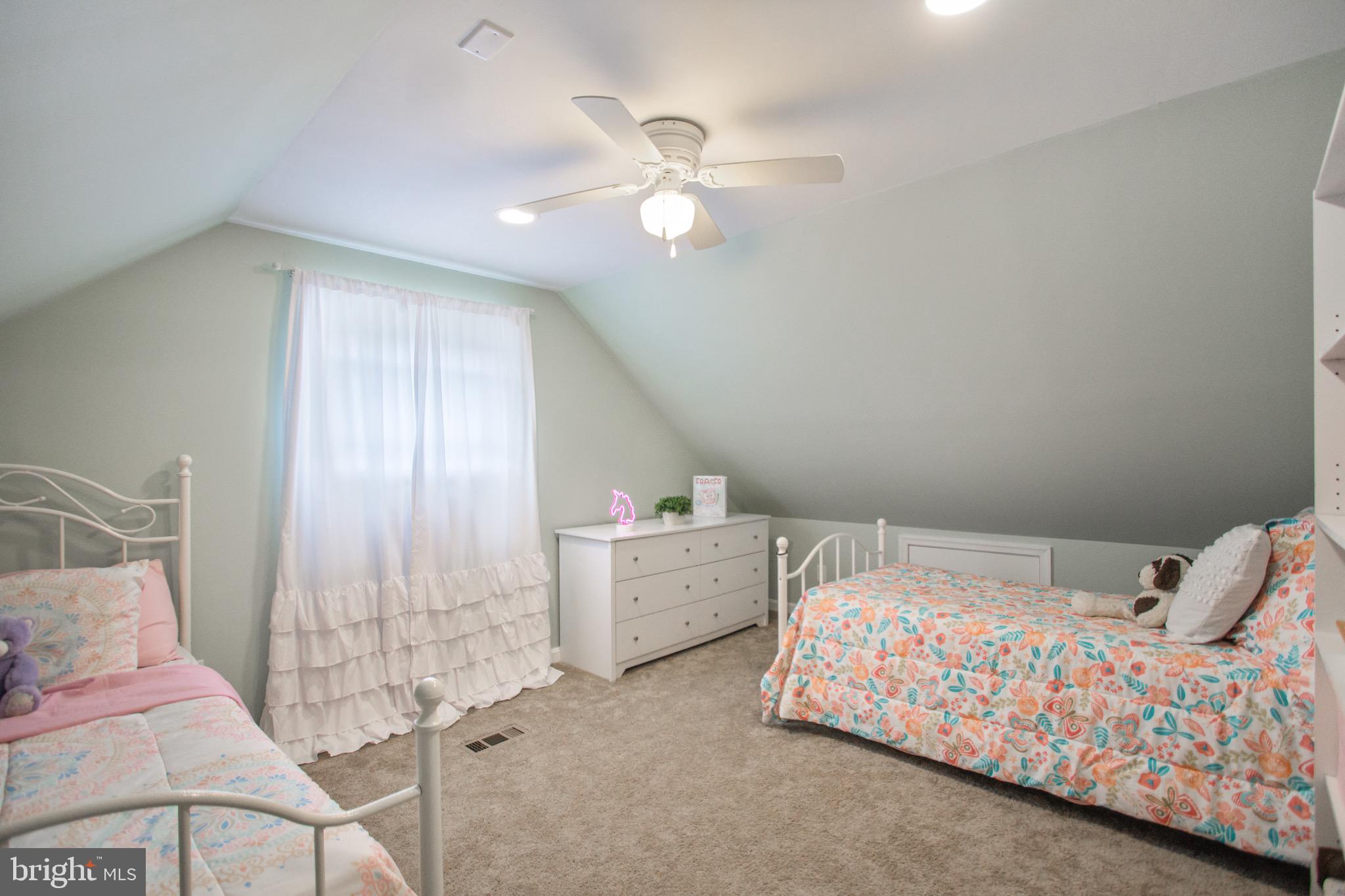 205 South Longcross Road Linthicum Heights, MD 21090 - Photo 34 of 57 a bedroom with a bed and a chandelier