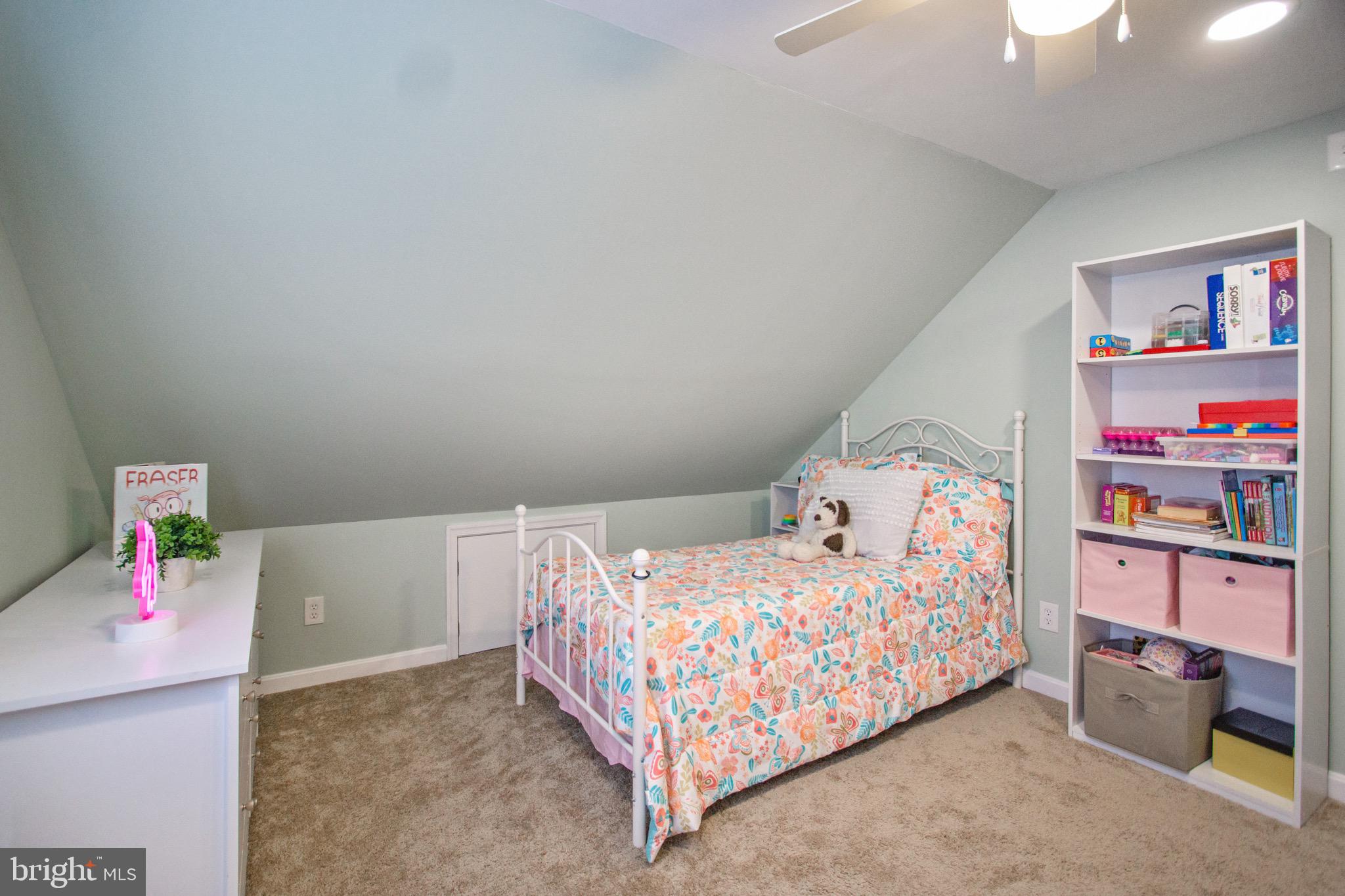 205 South Longcross Road Linthicum Heights, MD 21090 - Photo 36 of 57 a bedroom with a bed and book shelf