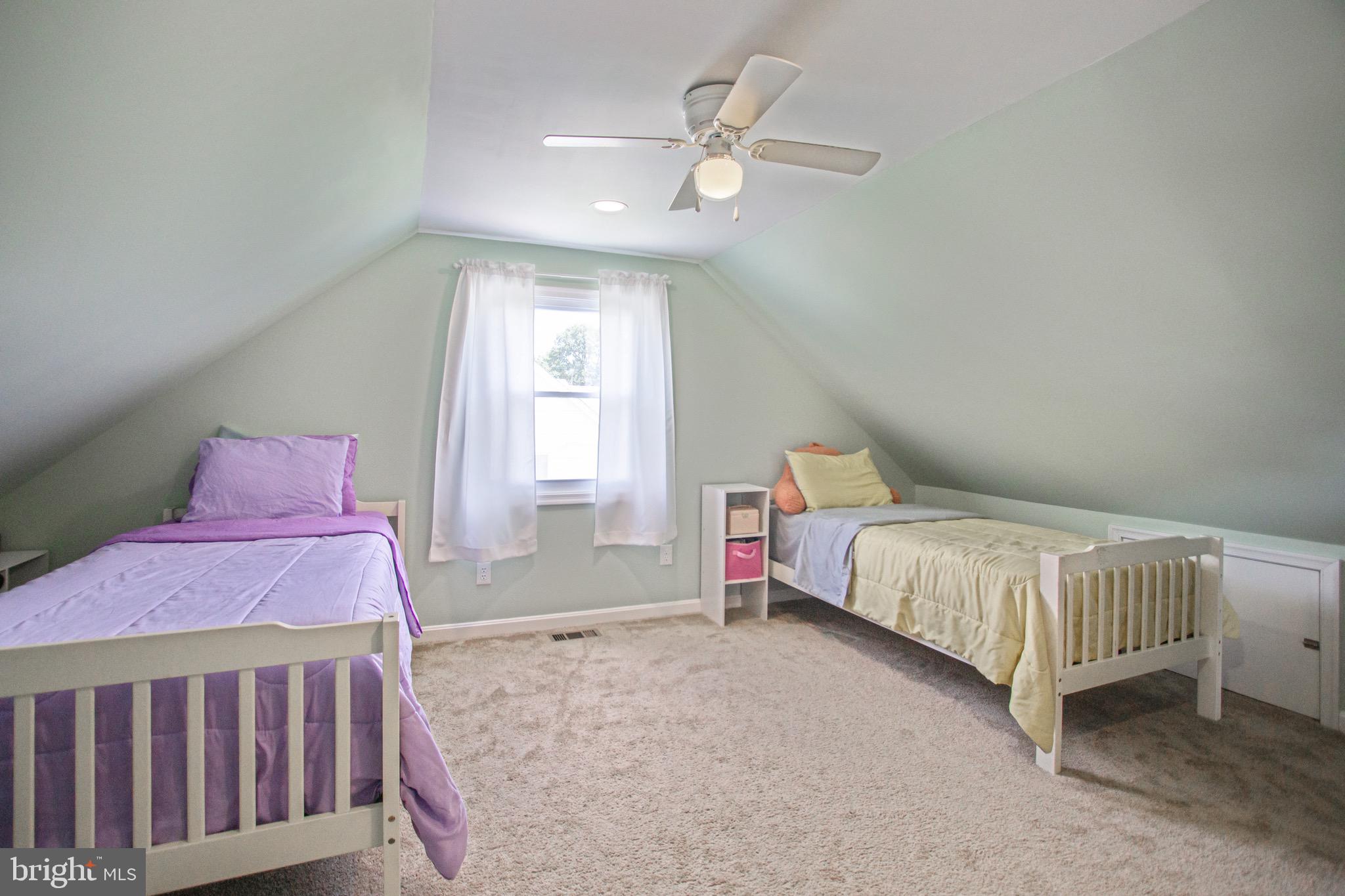 205 South Longcross Road Linthicum Heights, MD 21090 - Photo 44 of 57 a bedroom with a bed next to a window