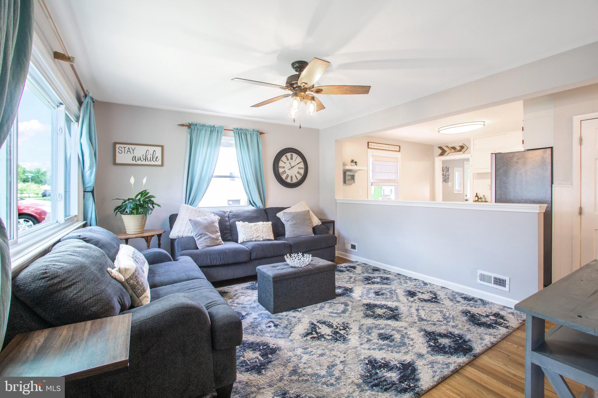 205 South Longcross Road Linthicum Heights, MD 21090 - Photo 5 of 57 a living room with furniture and a chandelier