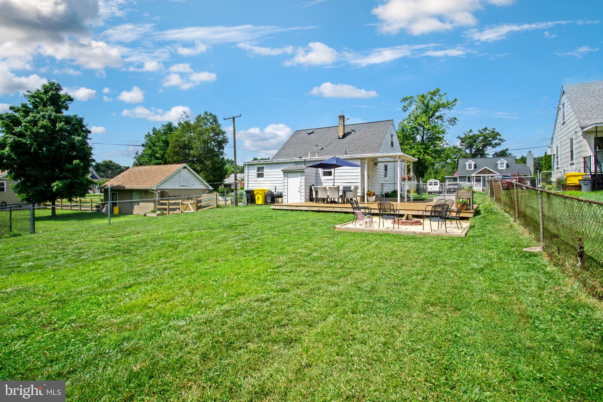 205 South Longcross Road Linthicum Heights, MD 21090 - Photo 53 of 57 a view of a house with a backyard porch and sitting area