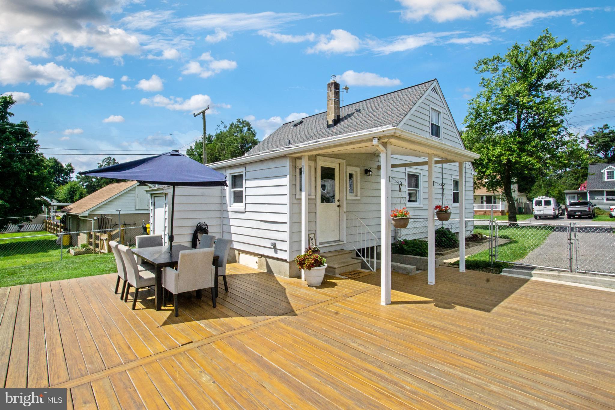 205 South Longcross Road Linthicum Heights, MD 21090 - Photo 56 of 57 a view of a patio with table and chairs under an umbrella