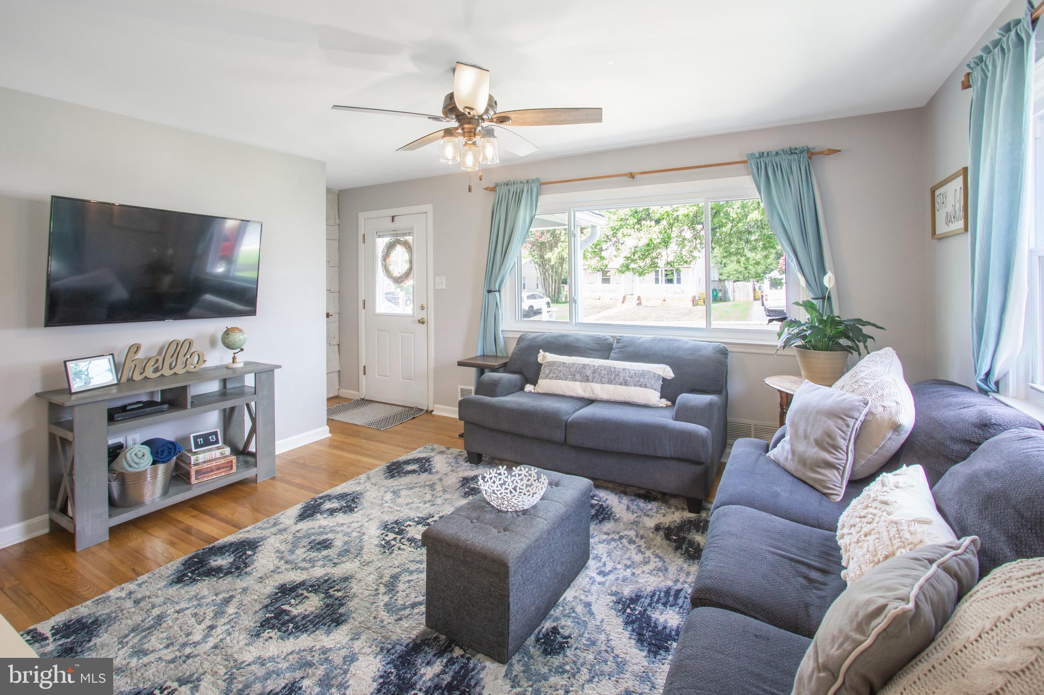 205 South Longcross Road Linthicum Heights, MD 21090 - Photo 7 of 57 a living room with furniture and a flat screen tv