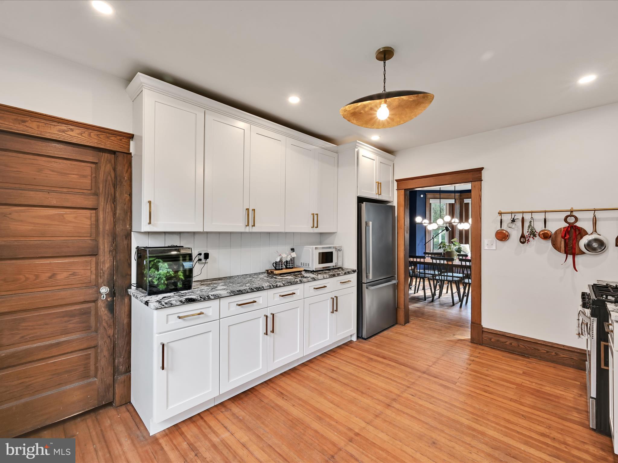 28 Charles Road Lancaster, PA 17603 - Photo 14 of 45 a kitchen with a refrigerator and white cabinets