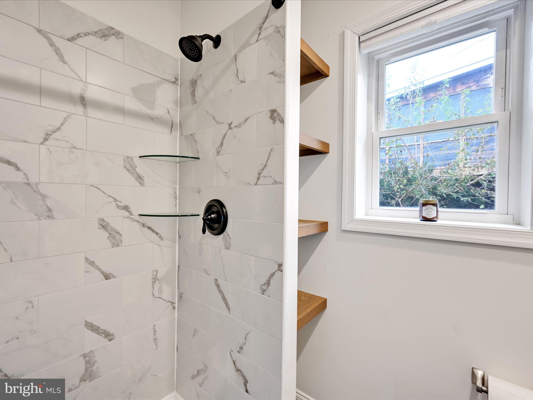 28 Charles Road Lancaster, PA 17603 - Photo 16 of 45 a bathroom with a bathtub and shower