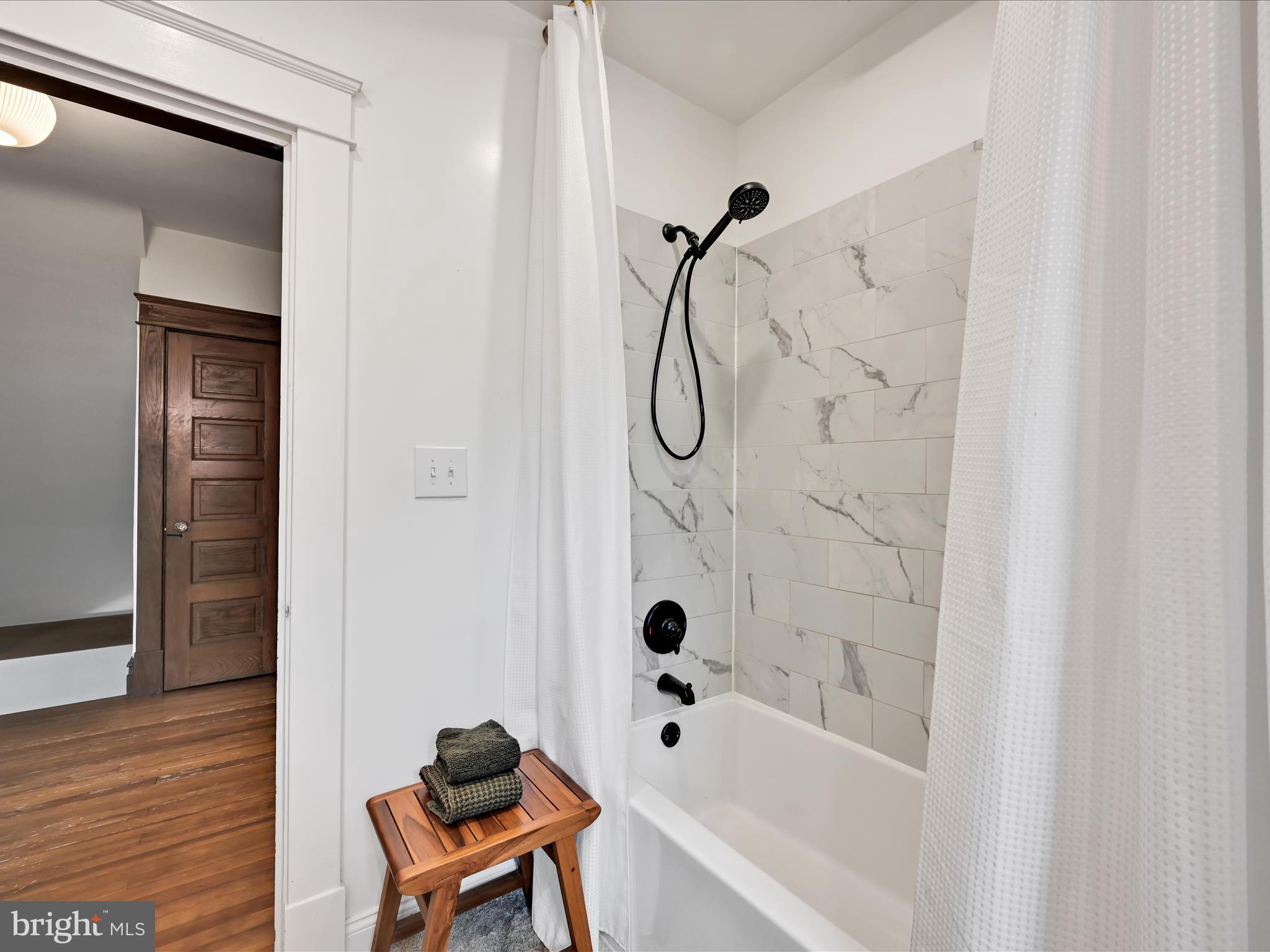 28 Charles Road Lancaster, PA 17603 - Photo 28 of 45 a bathroom with a bathtub and shower