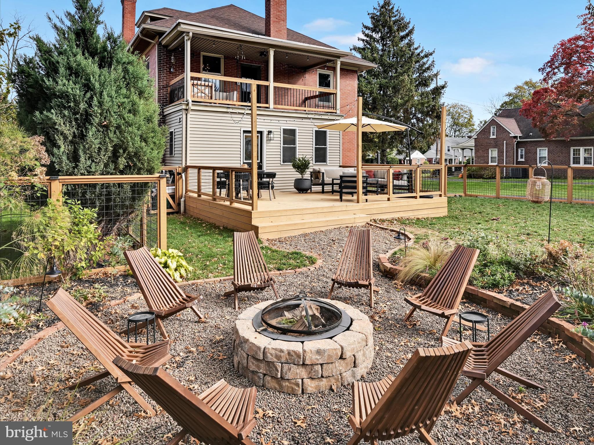 28 Charles Road Lancaster, PA 17603 - Photo 33 of 45 a view of a patio with couches table and chairs with plants and garden