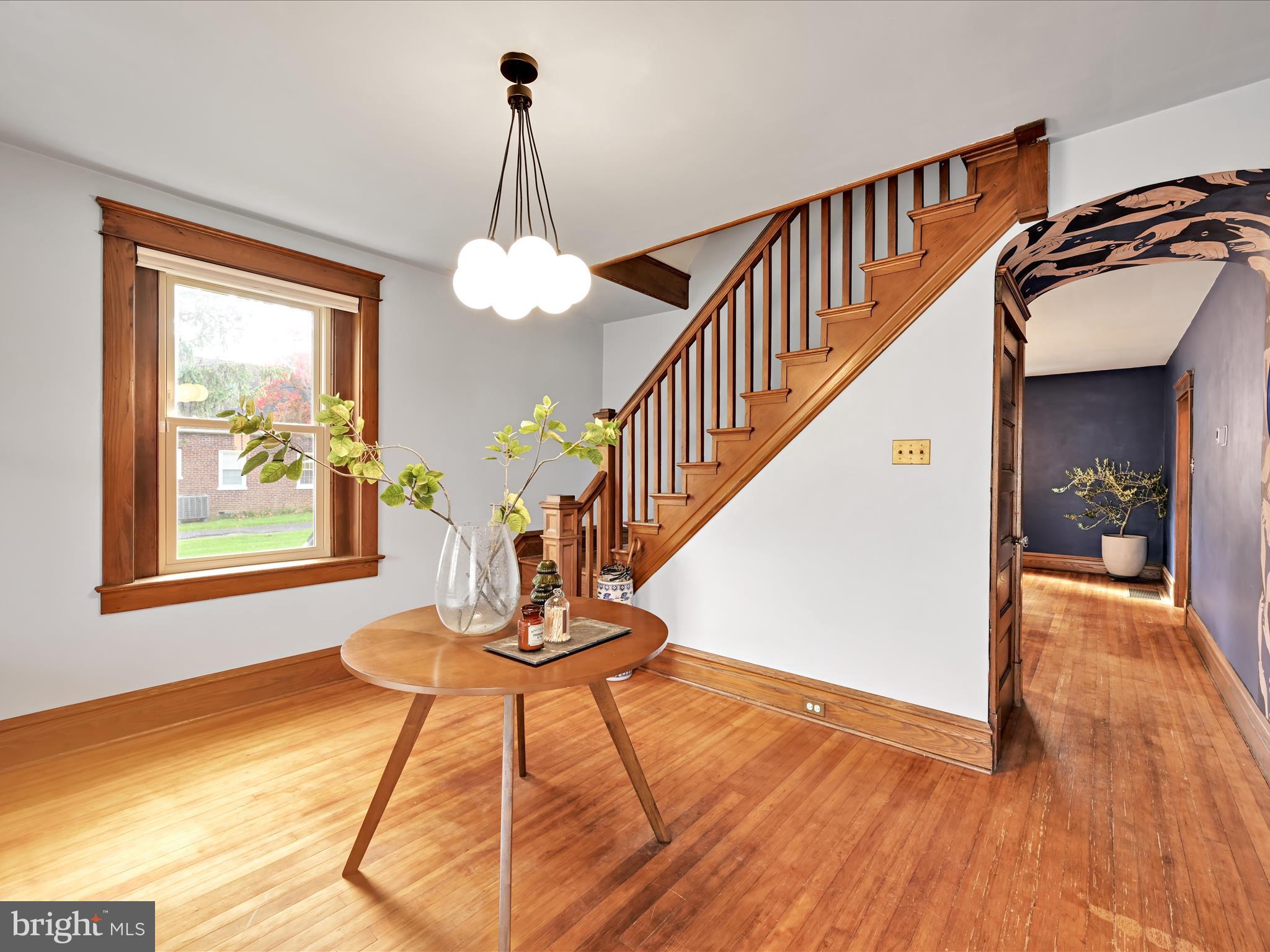 28 Charles Road Lancaster, PA 17603 - Photo 5 of 45 a view of a livingroom with furniture stairs wooden floor and front door