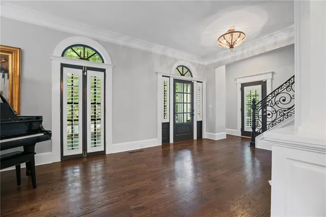 view of a kitchen with a sink and dishwasher a stove top oven with wooden floor