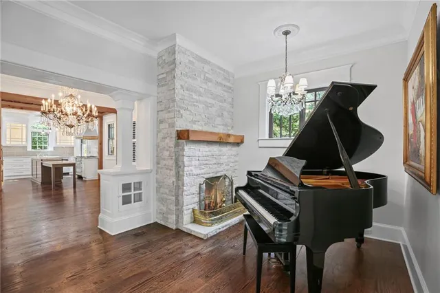 a kitchen with granite countertop a stove refrigerator and sink