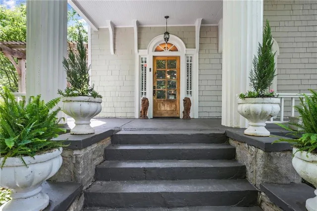 a view of a sitting area with furniture in backyard