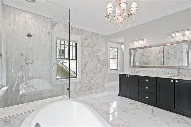 a kitchen with a sink and large windows