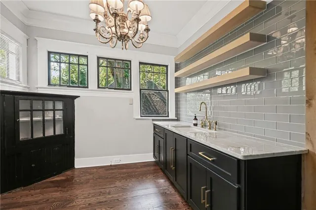 a view of a chairs and table in a backyard