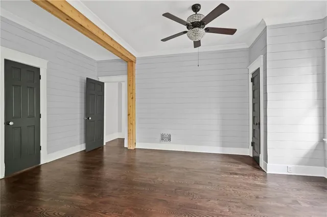 a backyard of a house with lots of green space and fountain