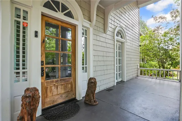 a view of a room with wooden floor windows and stairs