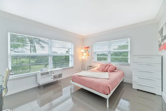 a room with a bed and a table in it