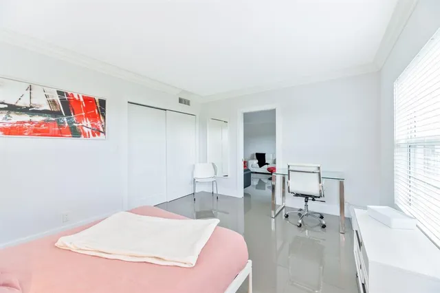 a kitchen with granite countertop a refrigerator and a sink